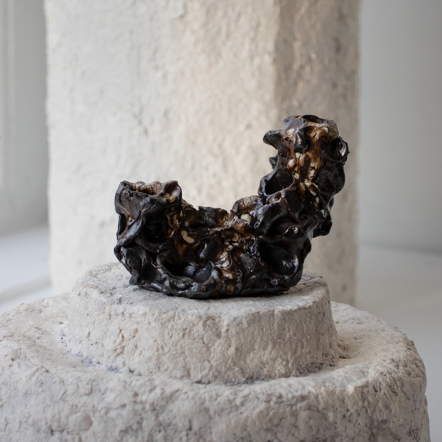 Unique 3 x 5 x 3 inch hand-built Zanzibar clay double candelabra with white crawl and clear glazes by Bobbi Salvör Menuez.