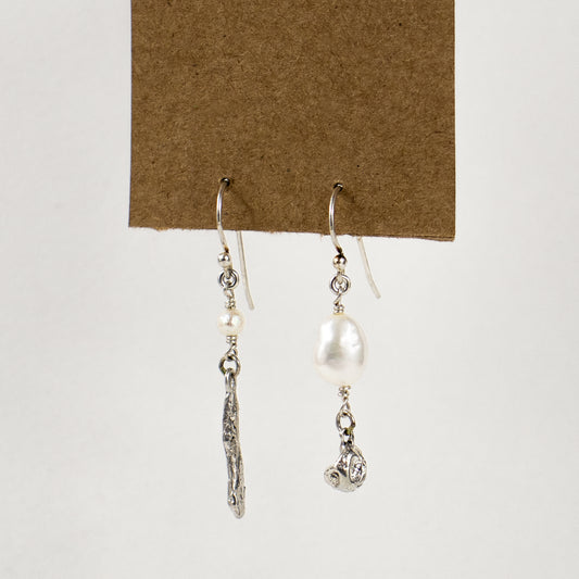 Asymmetric reclaimed sterling silver seaweed pods with freshwater pearls dangling from sterling hooks handmade and finished in our Catskills store-studio