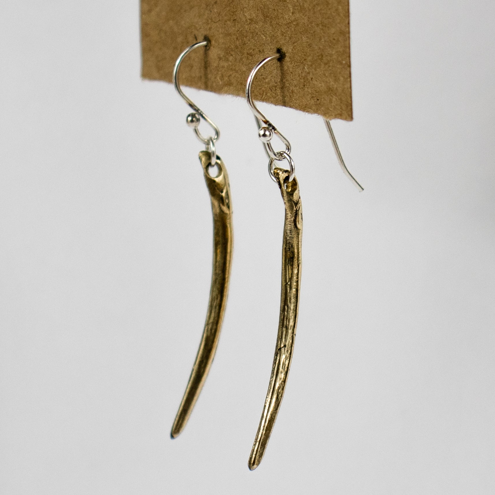 The fishbone is available in either solid reclaimed sterling silver or brass measuring 1.5 inches in length both dangling from sterling silver hooks and jump-rings.