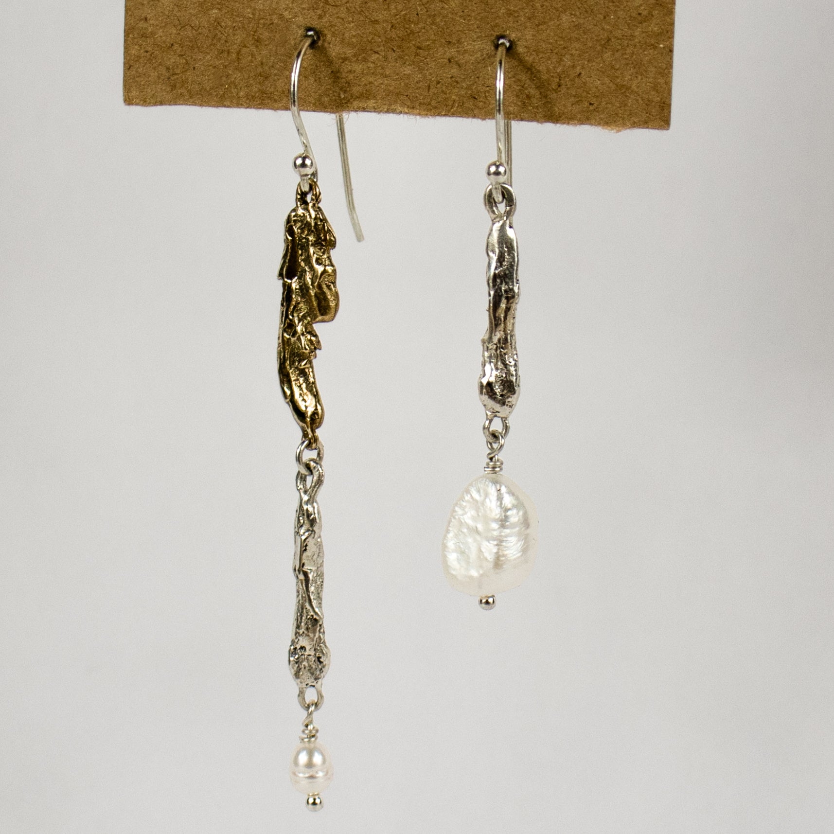Three reclaimed sterling silver and brass seaweed castings with two freshwater pearls dangling 1.5 and 2.25 inches from sterling hooks handmade and finished in our Catskills store-studio.