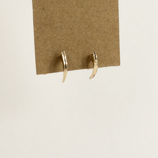 Solid reclaimed 10k gold Icelandic owl claw stud 0.75 inches in length on sterling silver posts handmade and finished in our Catskills store-studio shown on model.