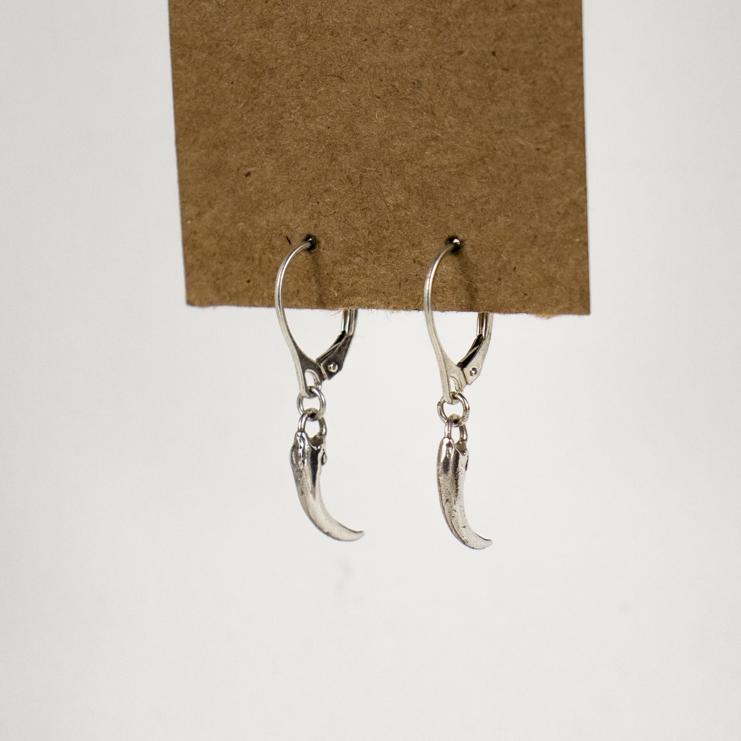 Solid reclaimed sterling silver or brass Icelandic 0.75 inch owl claws on sterling hoops finished in our Catskills store-studio and available as singles to mix-and-match.