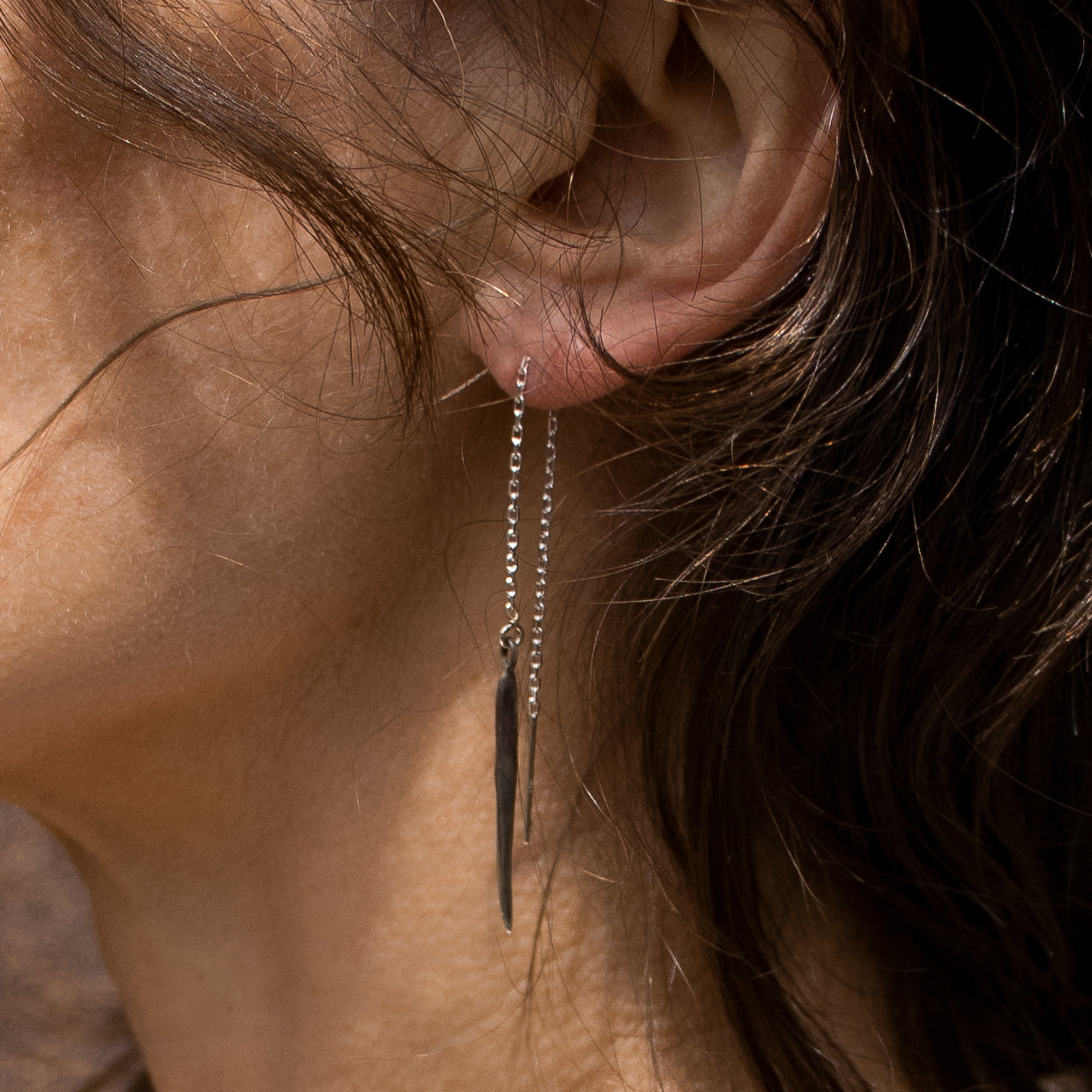 Solid reclaimed sterling silver spike measuring 1 inch and partially oxidized on sterling fine chain handmade and finished in our Catskills store-studio shown on model.