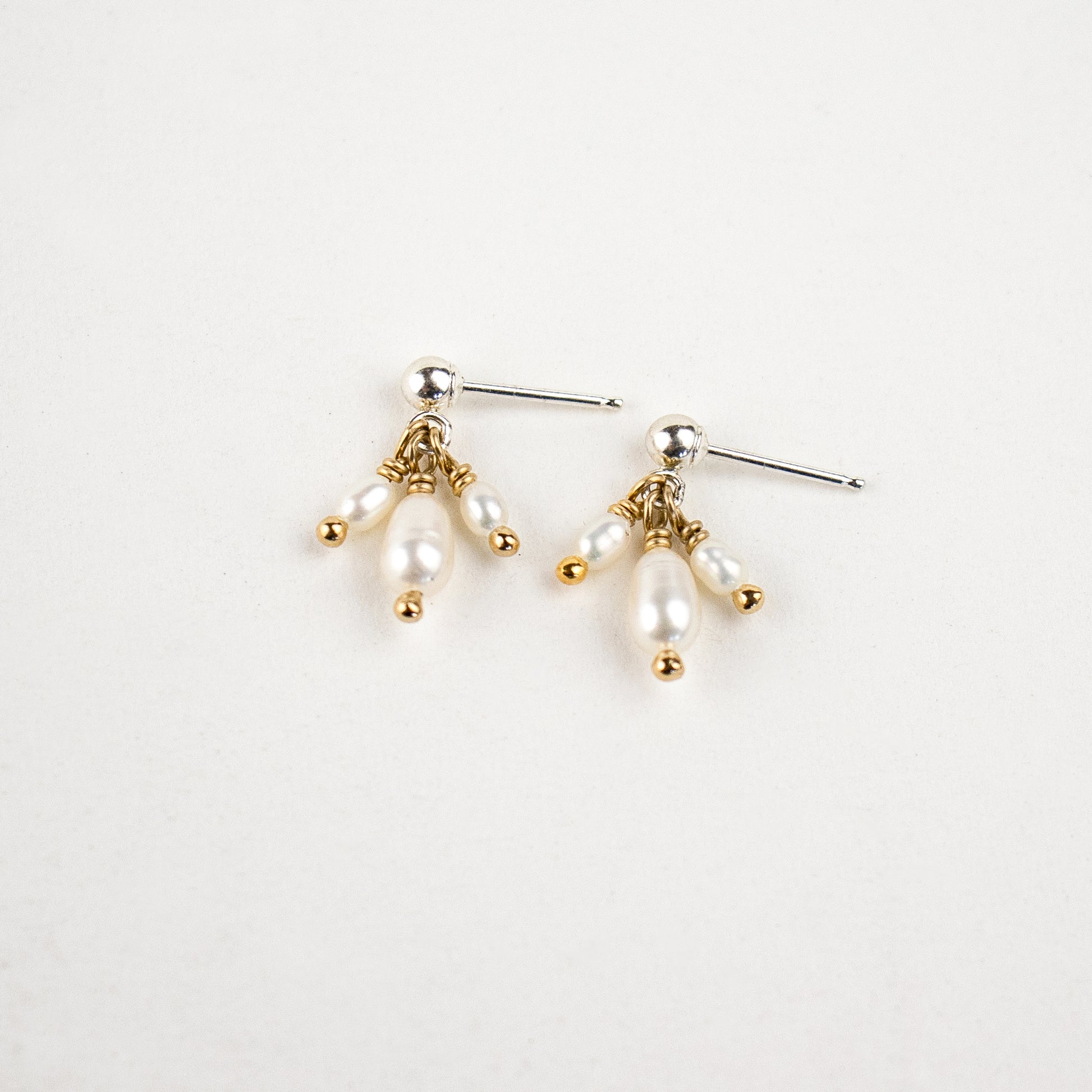 Reclaimed sterling silver stud earrings with three hand-beaded freshwater pearl teardrops handmade and finished in our Catskills store-studio.