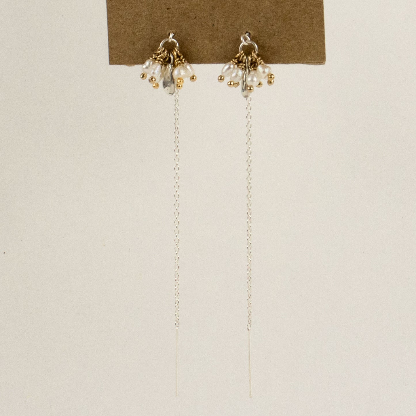 Reclaimed sterling silver threader earrings hand-beaded with seven freshwater pearl teardrops and sterling seed finished in our Catskills store-studio and available as singles to mix-and-match