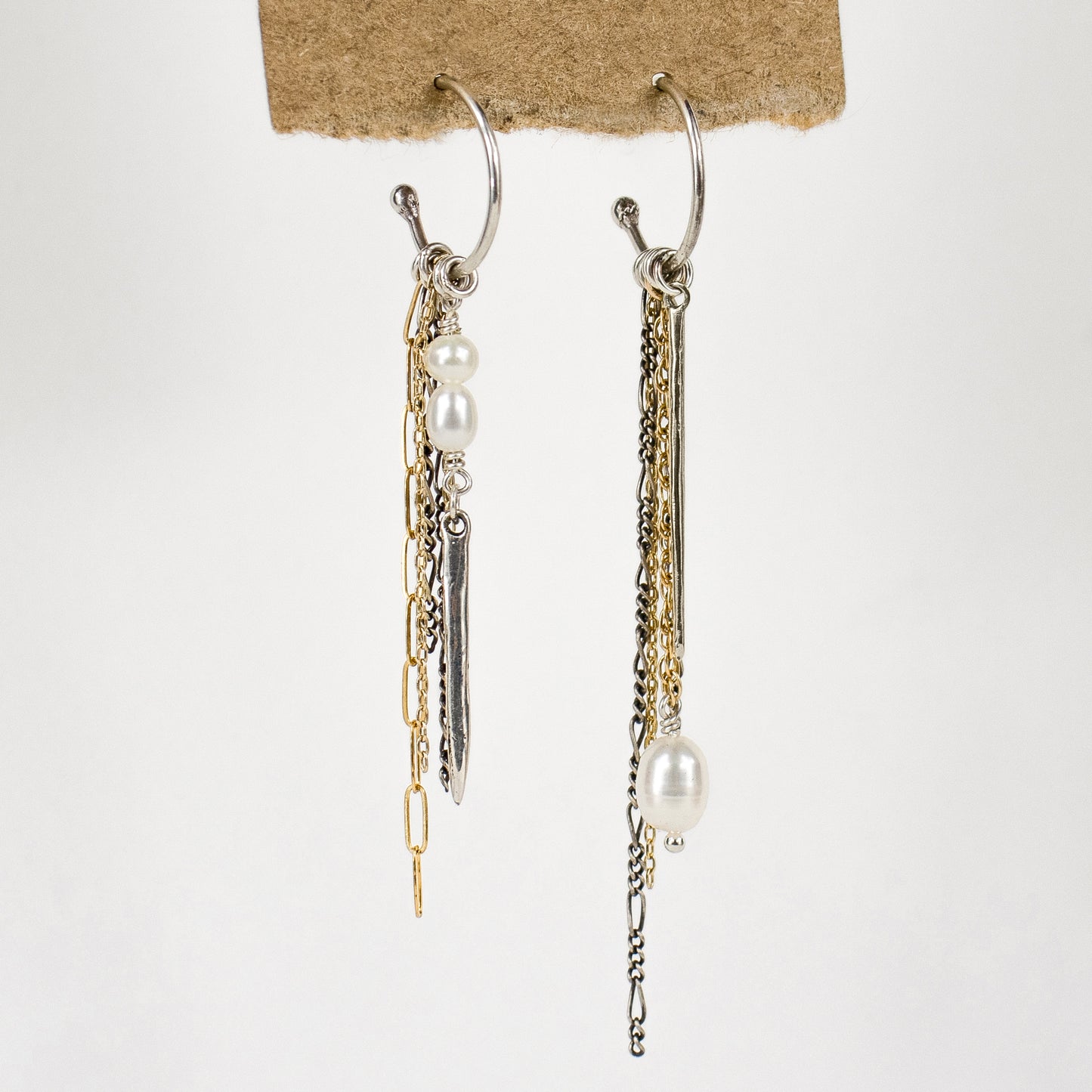Solid reclaimed sterling silver spikes with gold-filled and sterling mixed-chains and freshwater pearls on sterling hoops approximately 1.5 inches in diameter cast with reclaimed precious metals and handmade in the Catskills by Icelandic designer, Johanna Methusalemsdottir.