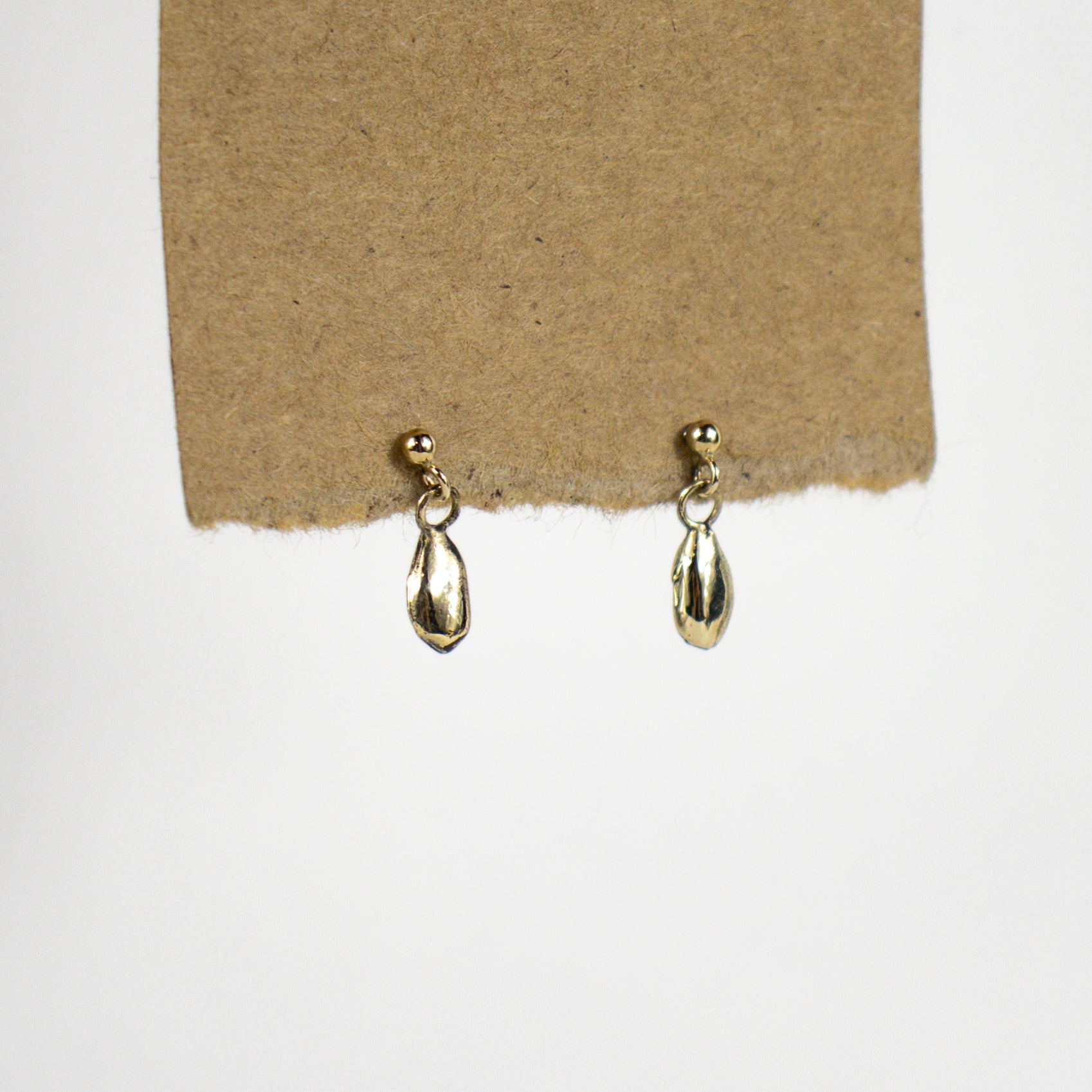 Solid reclaimed 10k gold seeds and jump-rings on gold-filled studs handmade and finished in our Catskills store-studio and available as singles to mix-and-match.