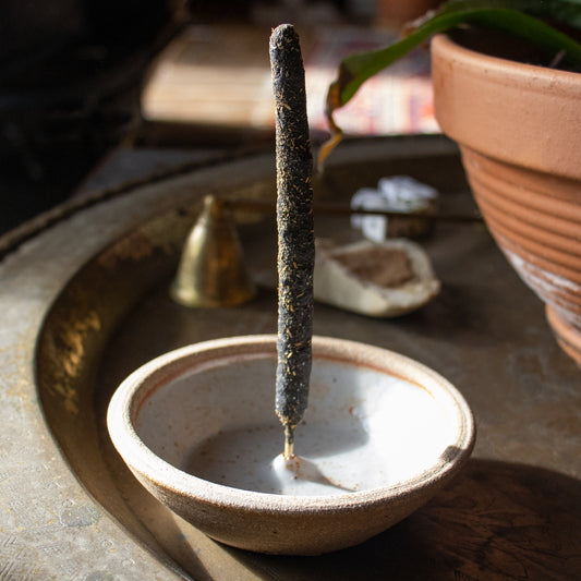 Elegant hand-thrown, northeastern stoneware clay incense burners wood-fired glazed on the inside and un-glazed on the outside available in cream or black and measuring 4.5 inches in diameter.