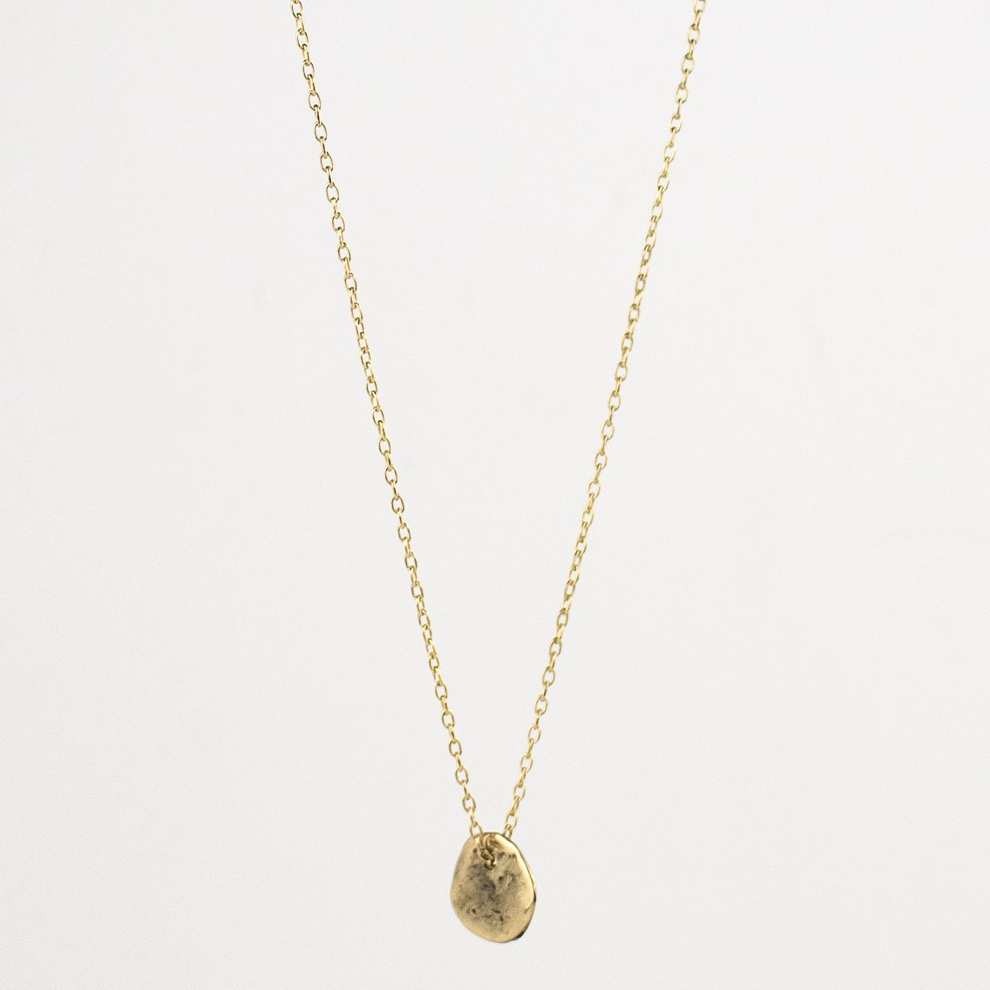 Solid reclaimed 0.5 inch Maine rock pendant available in your choice of 10k gold on gold-filled fine-chain or sterling silver on sterling fine-chain handmade and finished in our Catskills store-studio.