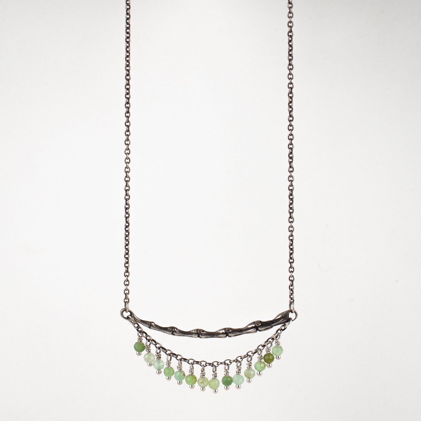 Reclaimed sterling silver 2 inch spine with hand-beaded fringe on sterling cable-chain adjustable 15 - 20 inches hand-beaded with your choice of chrysoprase, opal, watermelon tourmaline, aquamarine, moonstone, onyx, citrine, pyrite or labradorite. Handmade and finished in our Catskills store-studio.