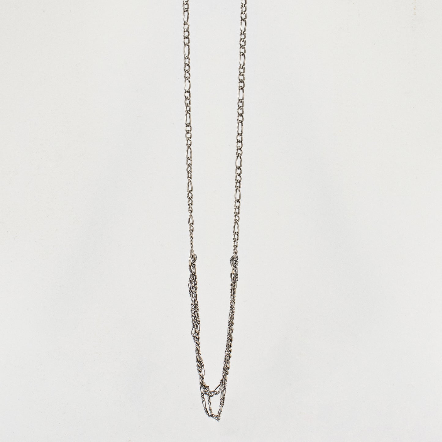 TANGLED SILVER FIGARO CHAIN NECKLACE