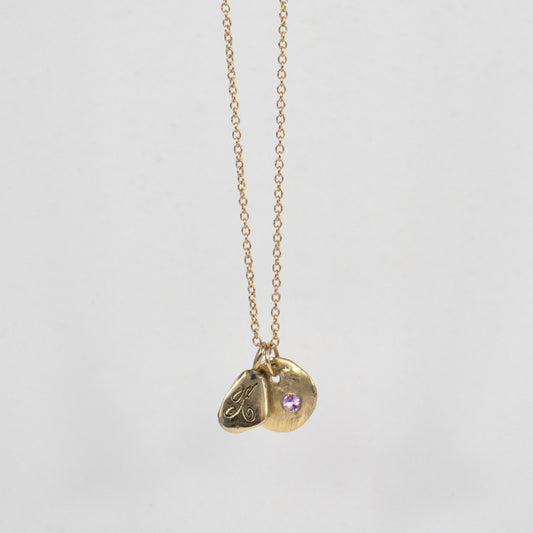 Solid reclaimed 14k gold Maine rock set with your choice of 2 mm baby pink or hot pink sapphire with 14k Kria signature tag on 18 inch 14k fine cable-chain made-to-order and finished in our Catskills store-studio shown with baby pink sapphire.