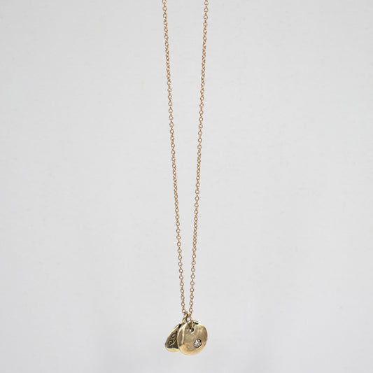 Solid reclaimed 14k gold Kria tag and Maine rock set with a 2mm diamond on an 18 inch 14k gold fine chain handmade and finished in our Catskills store-studio.