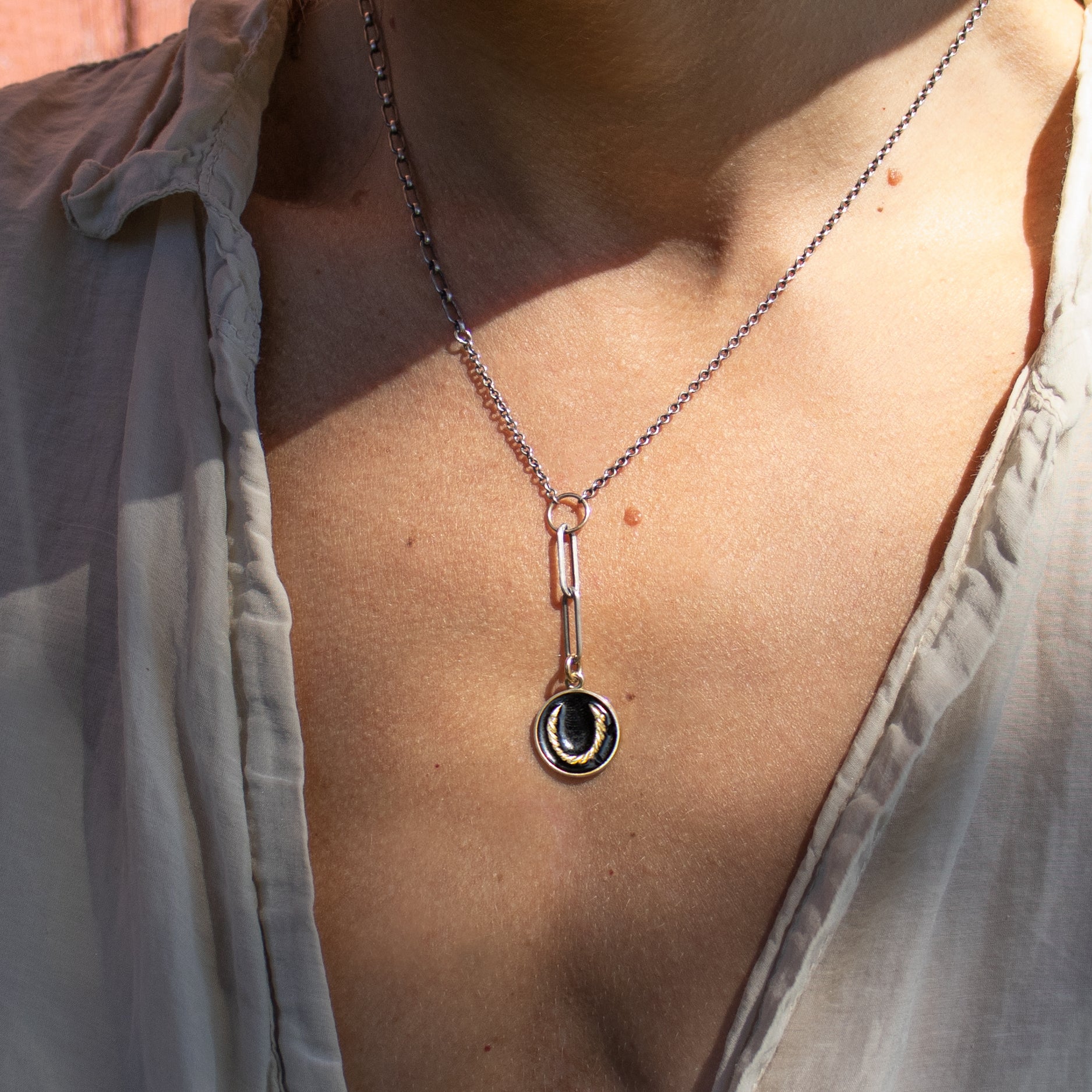 Enameled solid reclaimed 10k gold Roped Horseshoe charm 15 mm in diameter on sterling silver mixed-chain adjustable 16 - 18 inches with your choice of black or lemon enamel handmade and finished in our Catskills store-studio. Upright the symbol serves as a receptacle for good luck as well as protection for its owner.