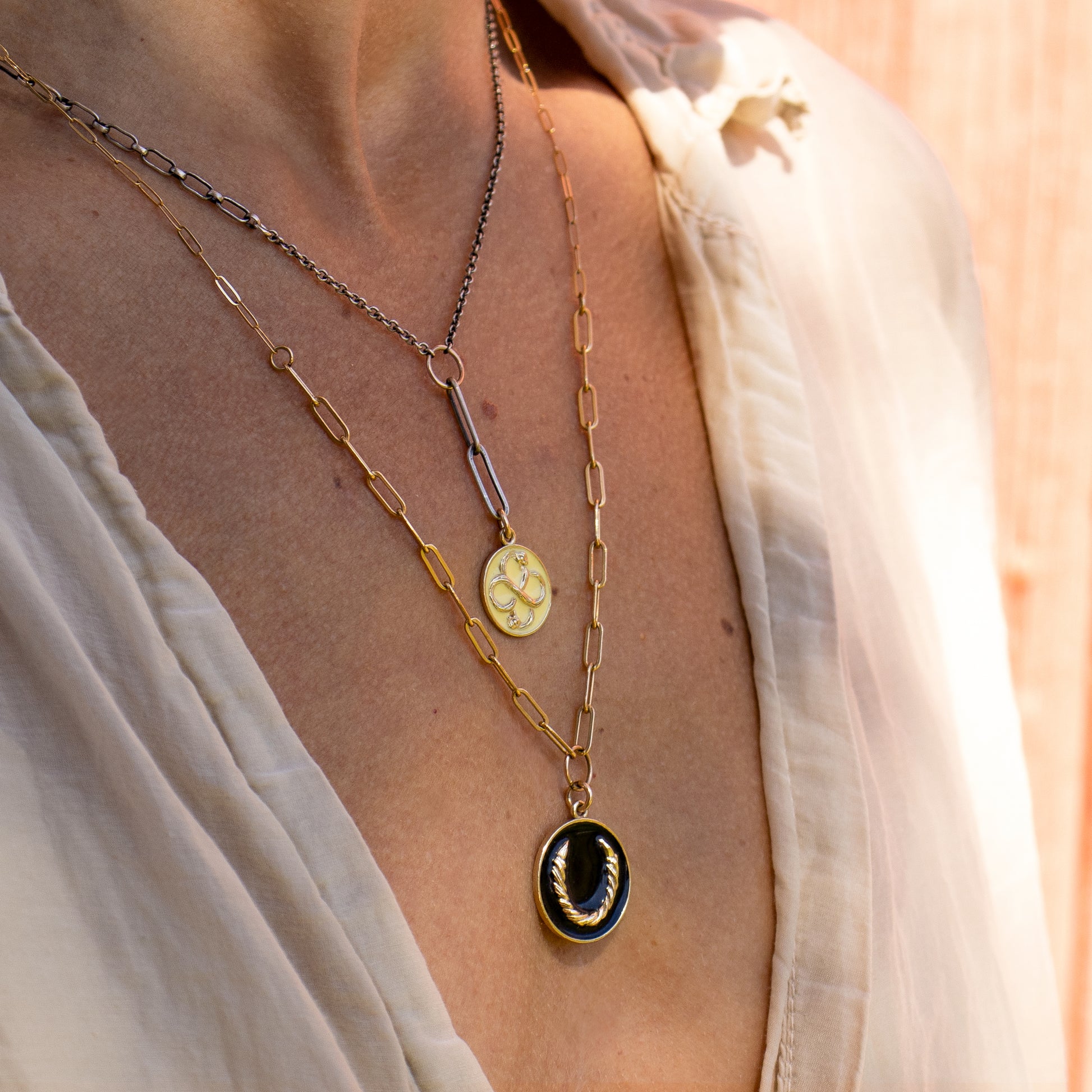 Solid reclaimed 10k gold Serpent Infinity Knot charm 15mm in diameter with your choice of black or lemon enamel on adjustable 16 - 18 inch sterling mixed-chain handmade and finished in our Catskills store-studio. Serpent symbolism can represent life and healing, and the infinite knot simplicity and balance.