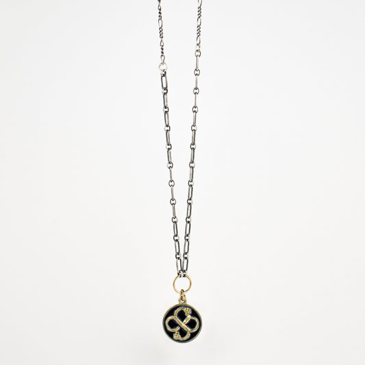 Enameled solid reclaimed 10k gold Serpent Infinity Knot charm on sterling mixed-chain adjustable 16 - 18 inches with charm 15 mm in diameter in your choice of black or lemon enamel. Serpent symbolism can represent life and healing, and the infinite knot simplicity and balance