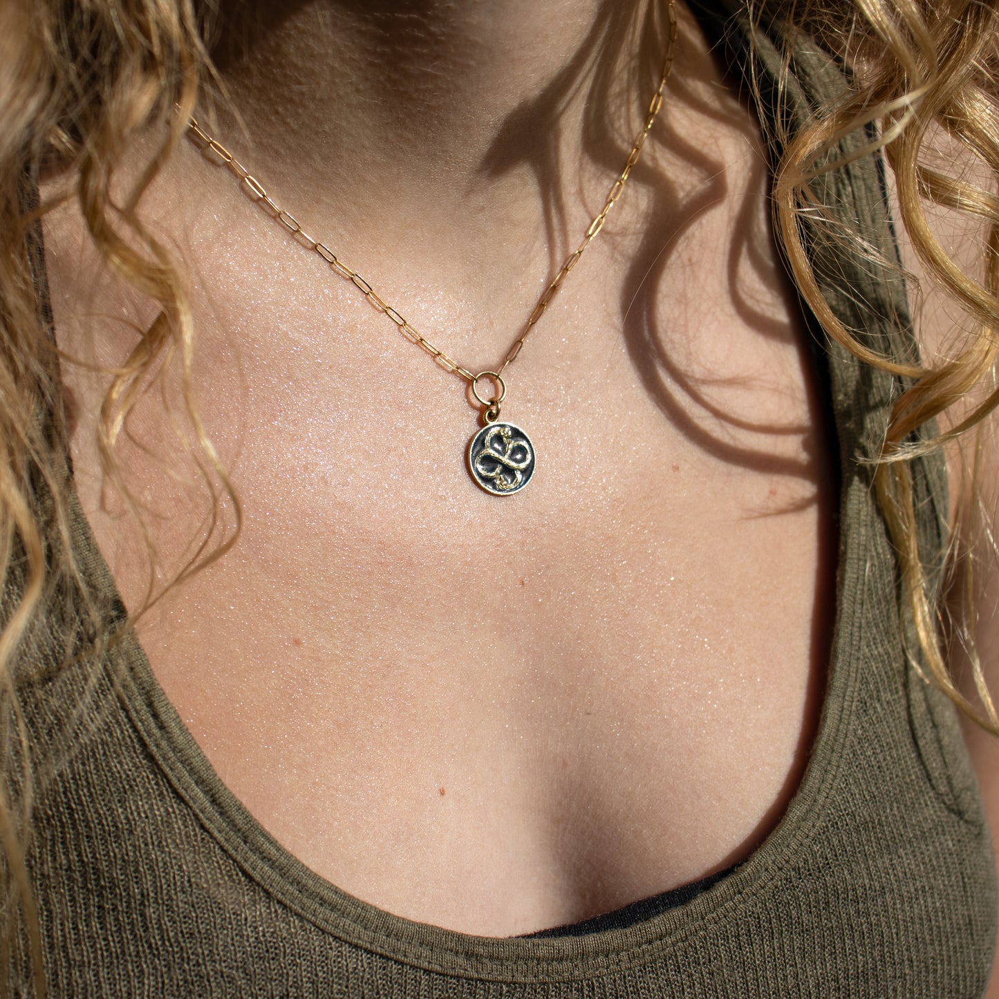 Solid reclaimed 10k gold Serpent Infinity Knot charm 15 mm in diameter with your choice of black or lemon enamel on gold-filled fine paperclip chain adjustable 16 - 18 inches handmade and finished in our Catskills store-studio. Serpent symbolism can represent life and healing, and the infinite knot simplicity and balance.