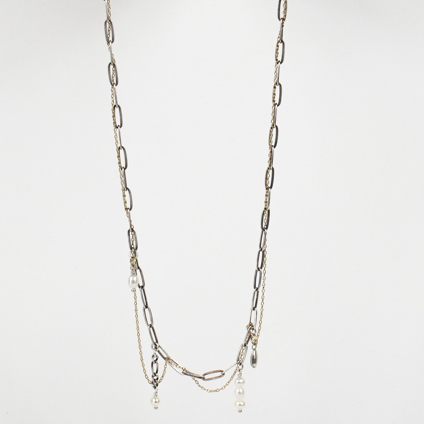 Tangled fine gold-filled and sterling silver paperclip chains with hand-beaded pearl drop-chains and solid reclaimed sterling silver seed charm adjustable 16 - 20 inches and finished in our Catskills store-studio.