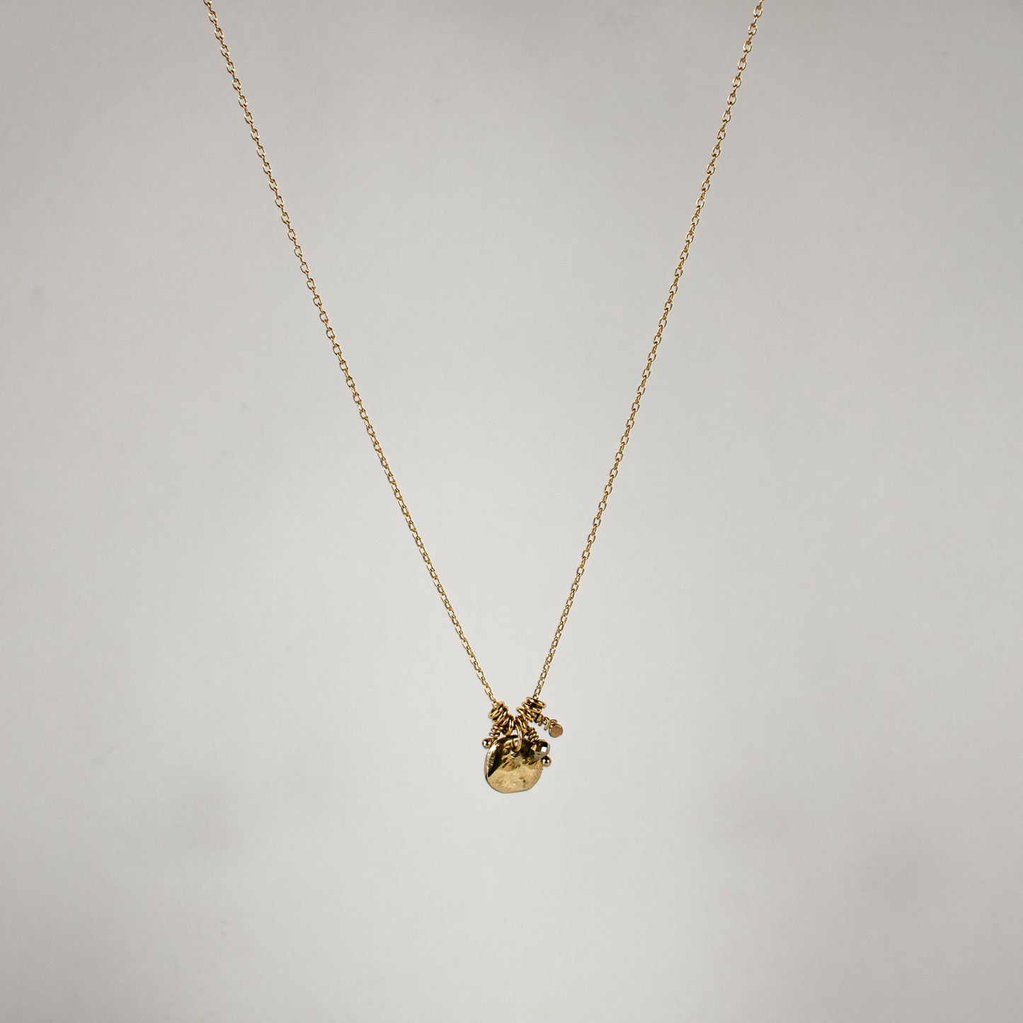 Solid reclaimed 10k gold rock and jump-rings on 16 inch fine gold-filled chain hand-beaded with a pyrite bead and finished in our Catskills store-studio.