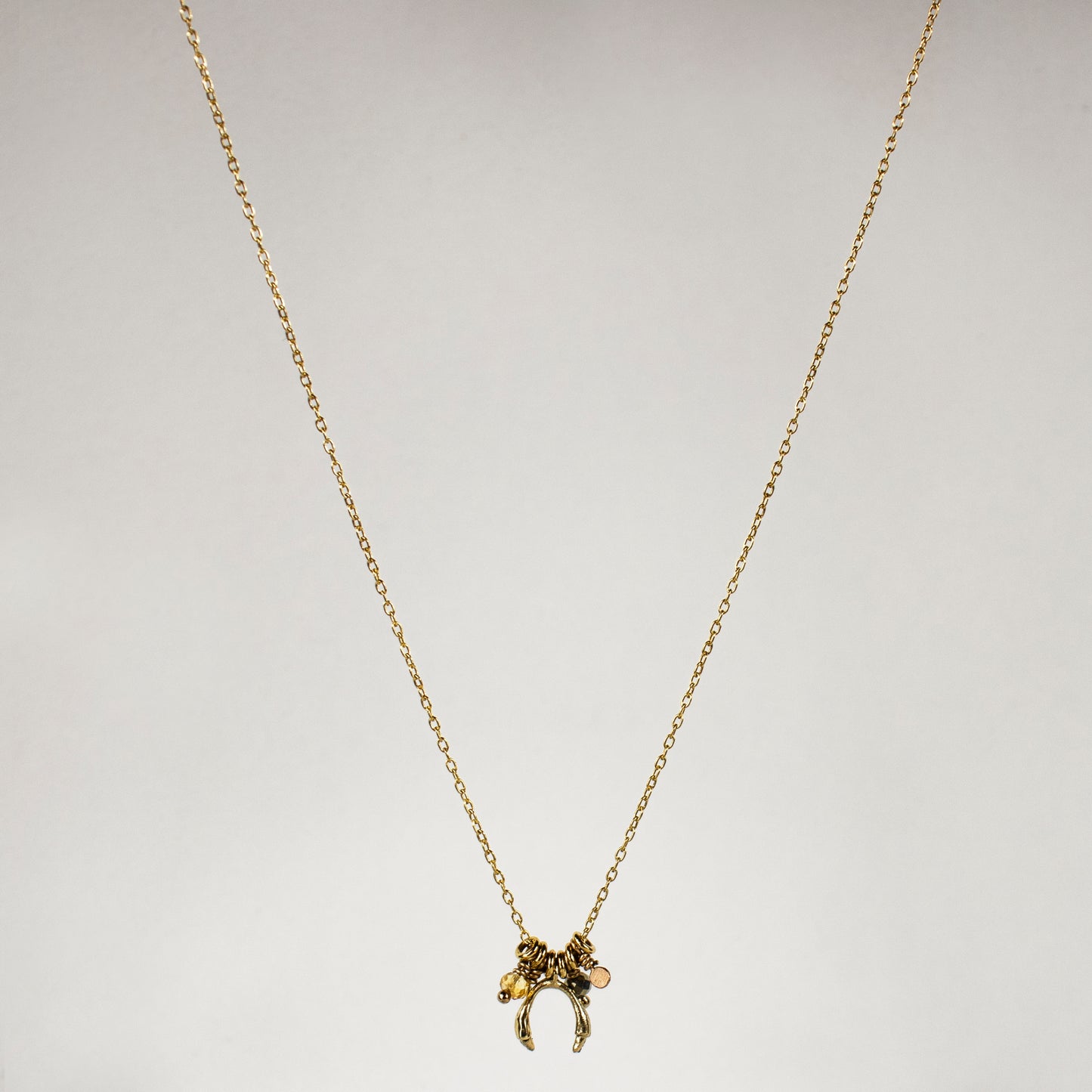 Solid reclaimed 10k gold horseshoe and jump-rings on 16 inch fine gold-filled chain hand-beaded with citrine and pyrite and finished in our Catskills store-studio.