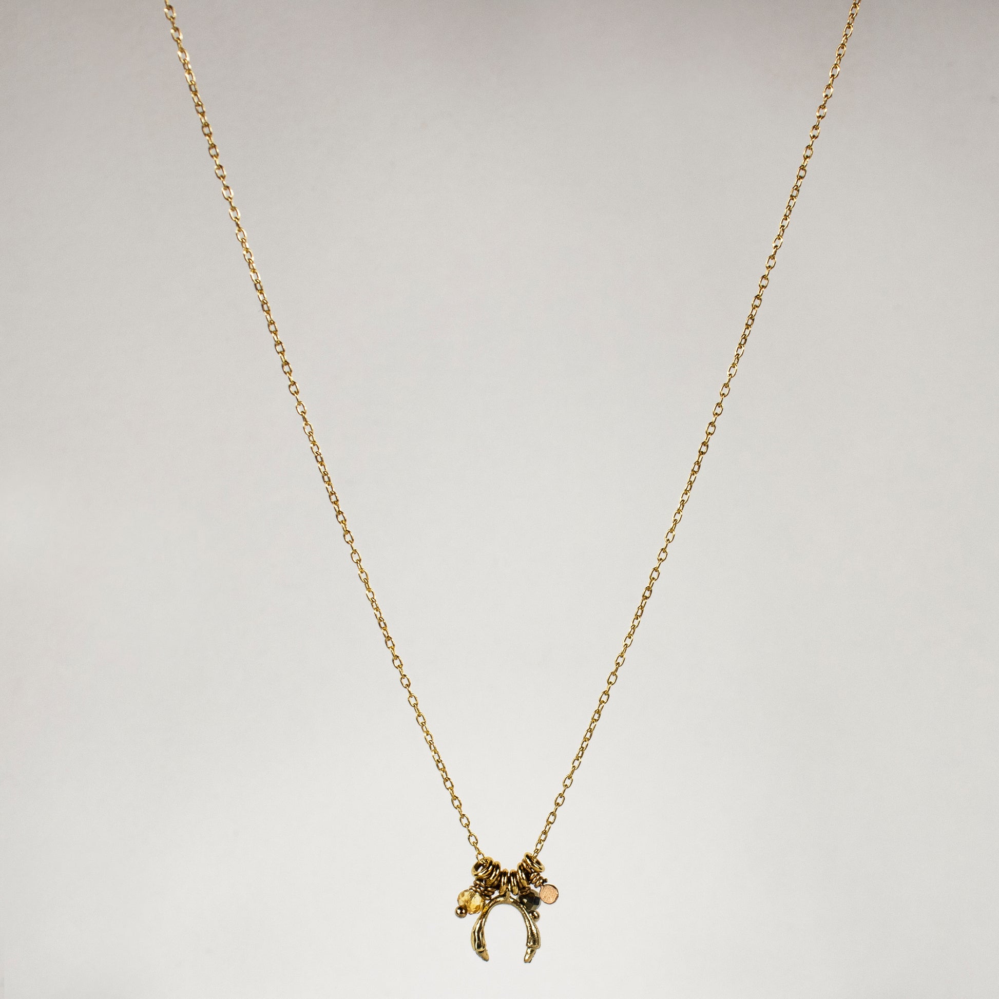 Solid reclaimed 10k gold horseshoe and jump-rings on 16 inch fine gold-filled chain hand-beaded with citrine and pyrite and finished in our Catskills store-studio.
