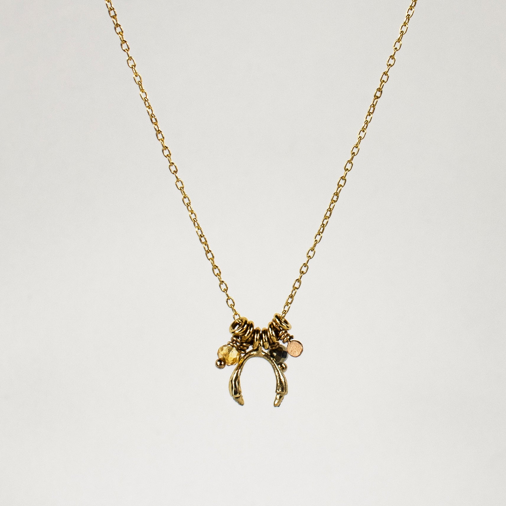 Solid reclaimed 10k gold horseshoe and jump-rings on 16 inch fine gold-filled chain hand-beaded with citrine and pyrite and finished in our Catskills store-studio.
