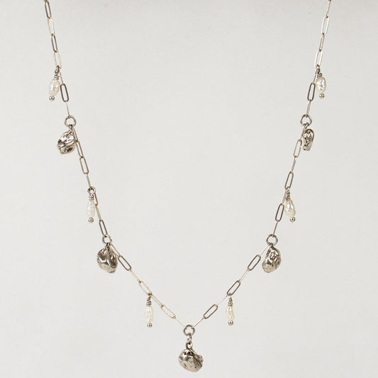 Five reclaimed sterling silver seaweed pods 5 mm each and six 3 mm freshwater pearls on fine sterling paperclip chain adjustable 16-18 inches handmade and finished in our Catskills store-studio.