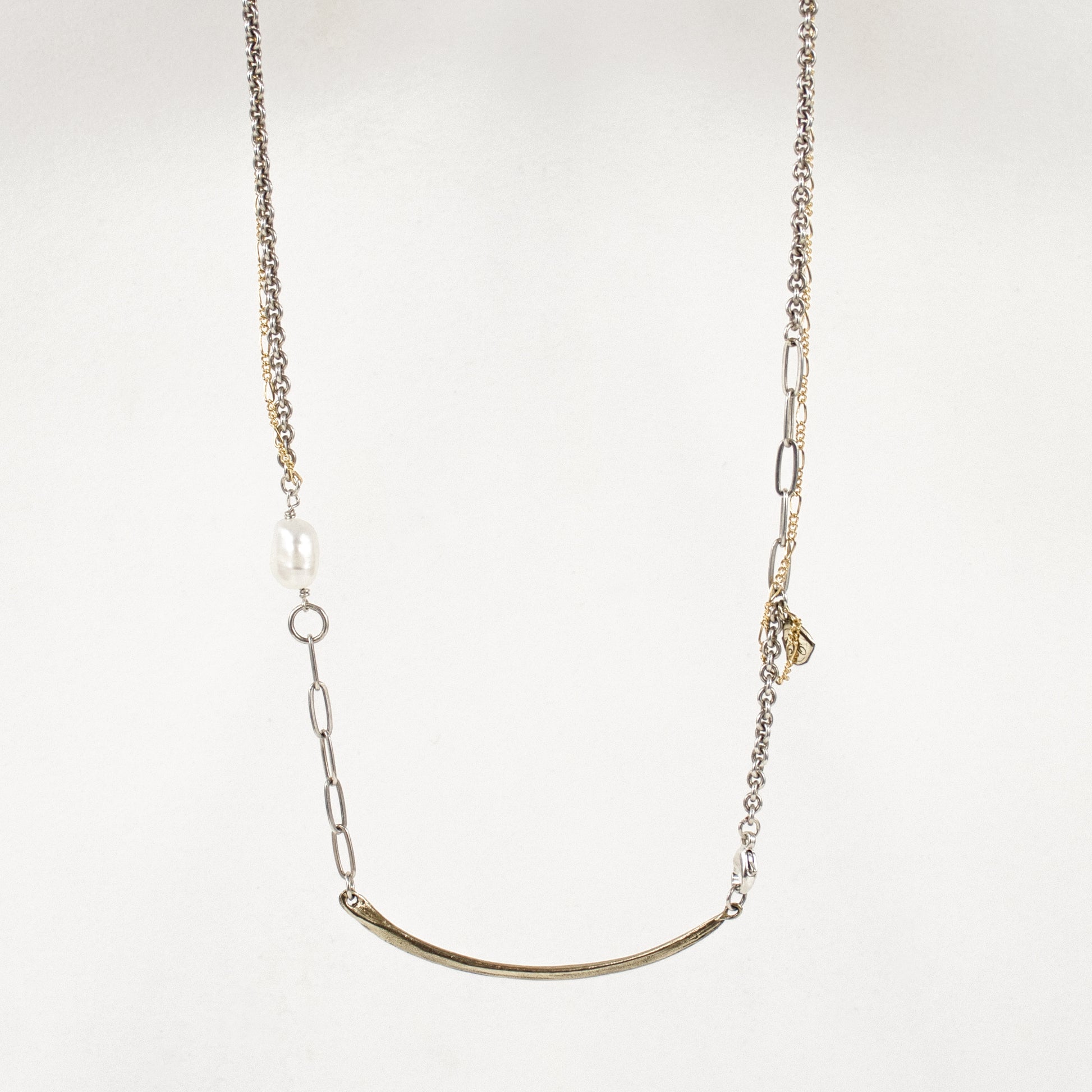 Arc pendant measuring 2 inches available in reclaimed sterling silver or brass on 16 inch sterling and gold-filled mixed-chain hand-beaded with a freshwater pearl handmade and finished in our Catskills store-studio