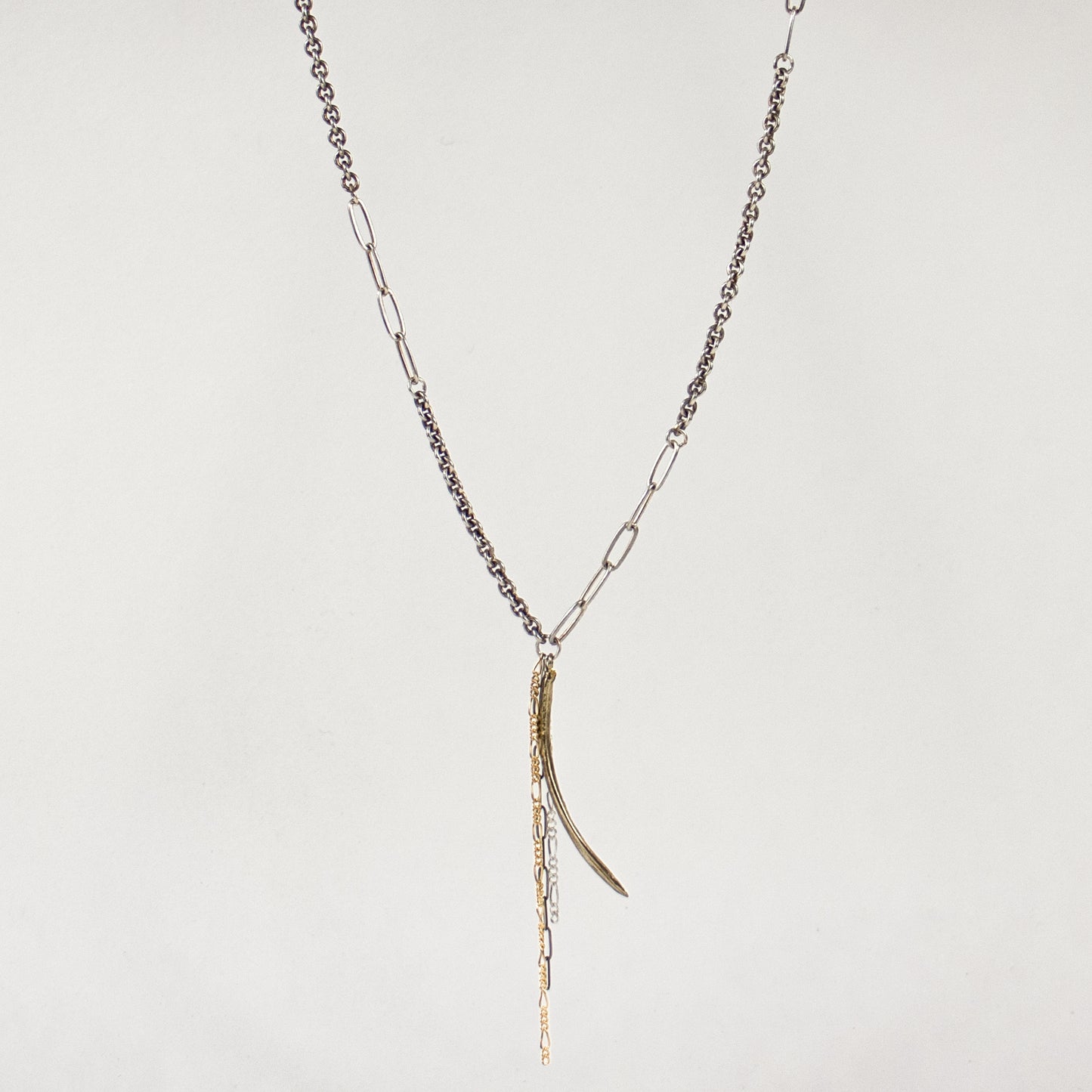 Arc charm measuring 1.5 inches available in sterling silver or brass with sterling and gold-filled tassels on heavy sterling silver mixed-chain adjustable 16-18 inches handmade and finished in our Catskills store-studio