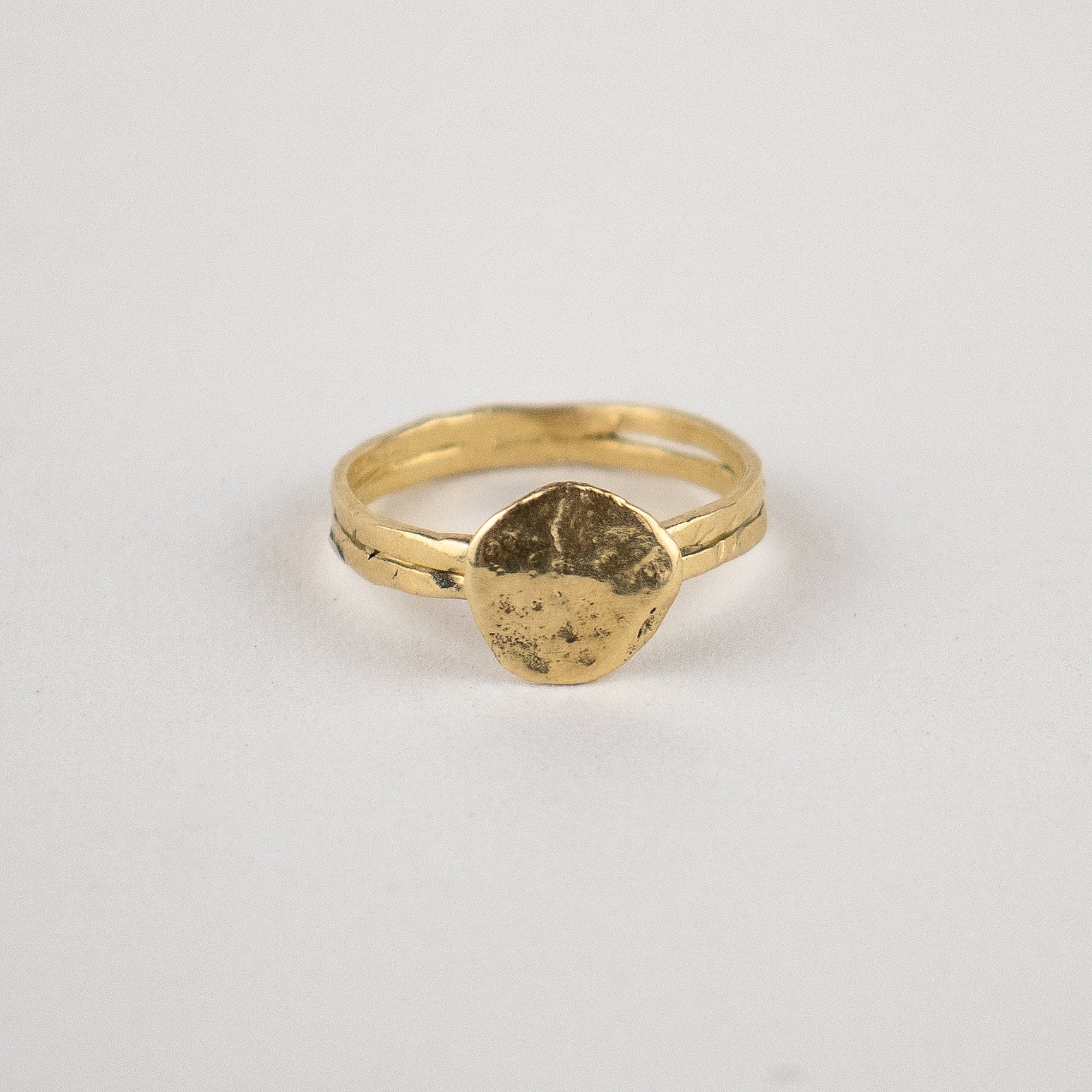 Solid reclaimed 10k gold hammer-finished Maine rock ring with 0.5 inch diameter face handmade and finished in our Catskills store-studio.