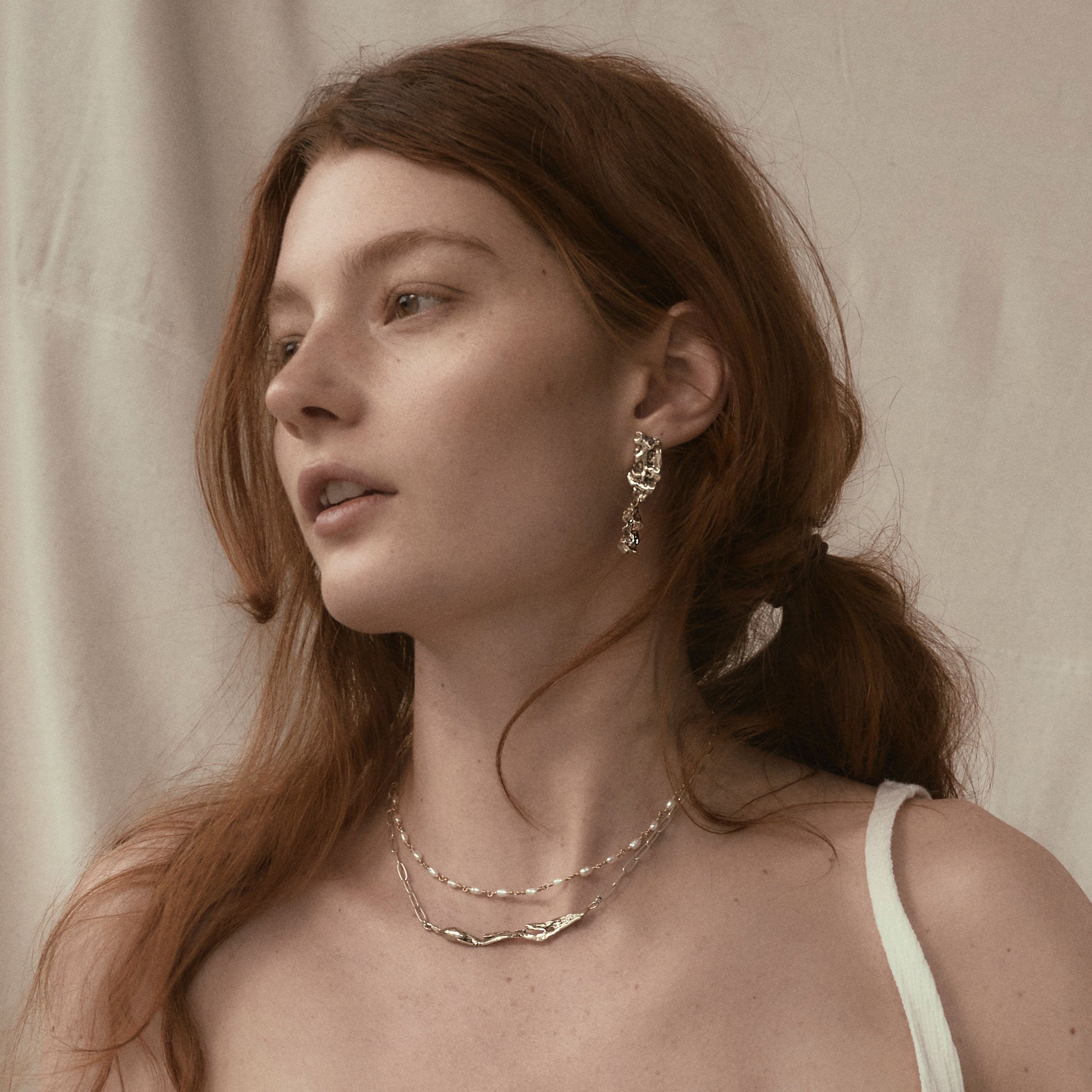 Reclaimed brass double-wave seaweed stud earrings measuring 2 inches in length with sterling silver posts, and brass 3 inch seaweed feather on sterling silver paperclip chain adjustable 16-18 inches handmade and finished in our Catskills store-studio