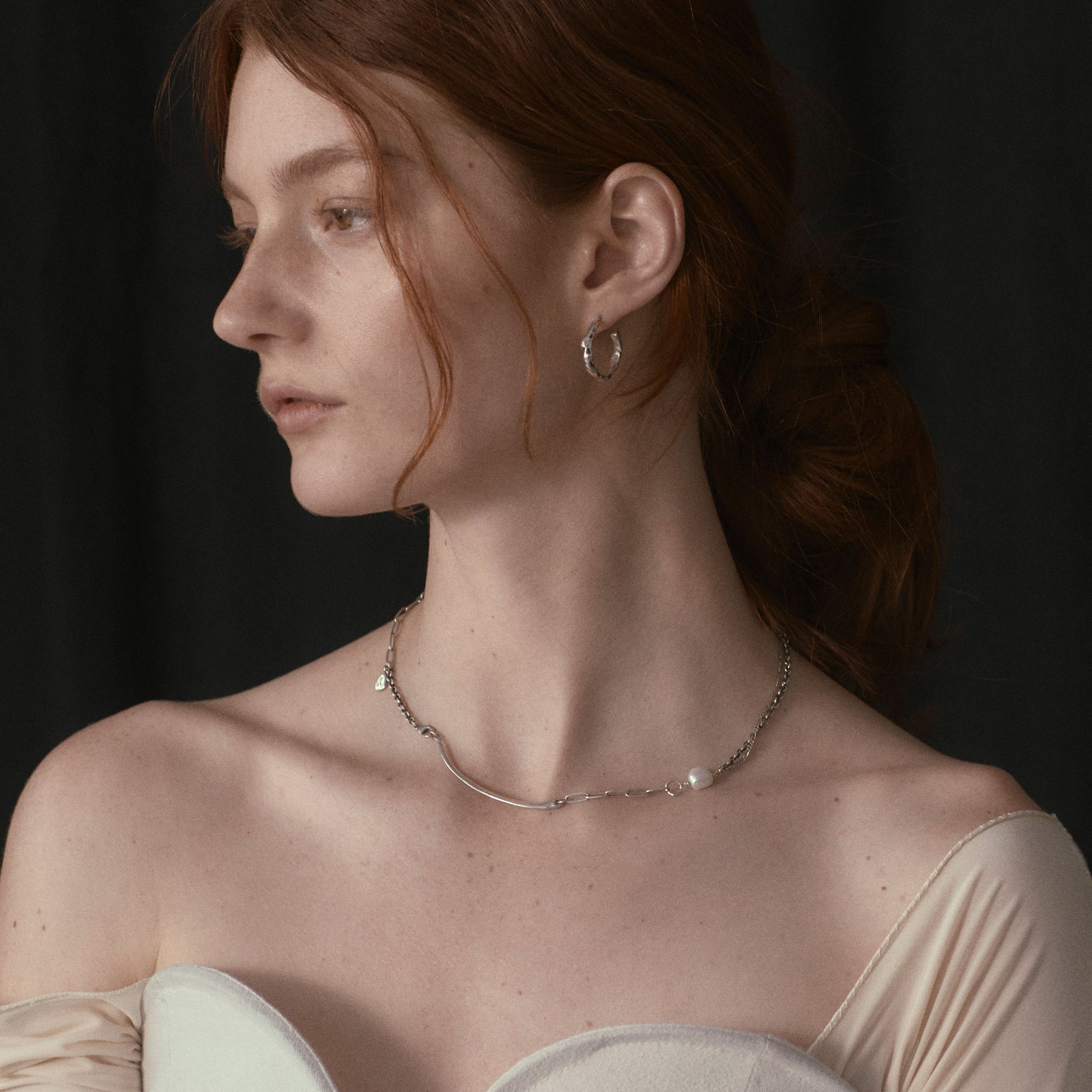 Arc pendant measuring 2 inches available in reclaimed sterling silver or brass on 16 inch sterling and gold-filled mixed-chain hand-beaded with a freshwater pearl handmade and finished in our Catskills store-studio