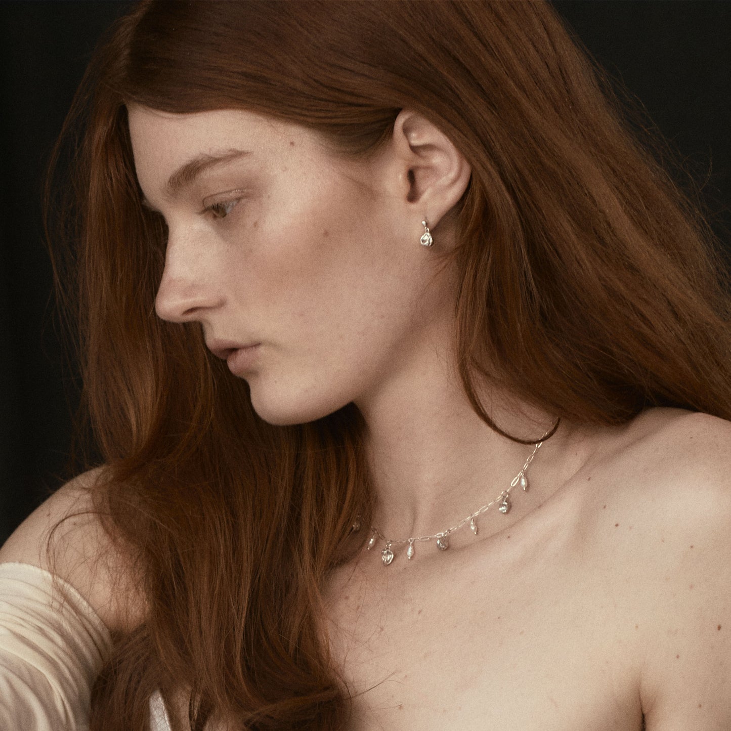 Five reclaimed sterling silver seaweed pods 5 mm each and six 3 mm freshwater pearls on fine sterling paperclip chain adjustable 16-18 inches handmade and finished in our Catskills store-studio.