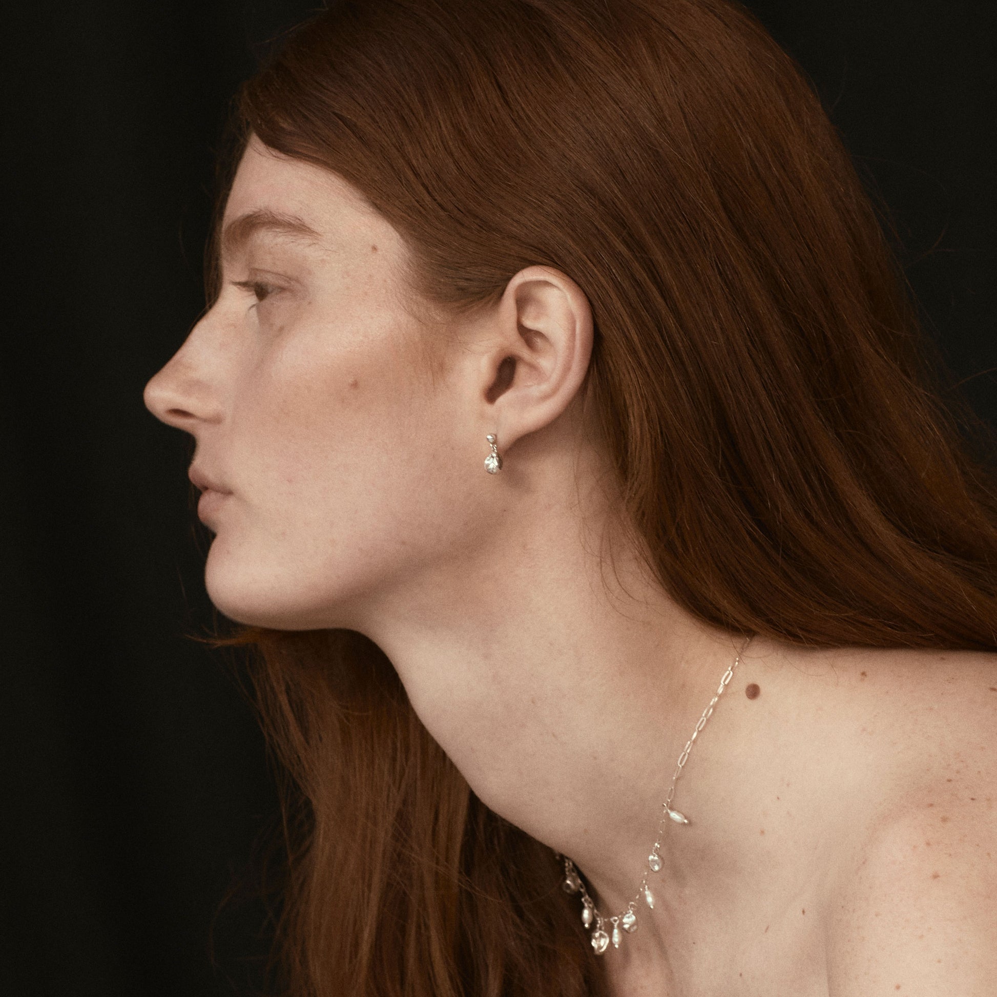 Small reclaimed sterling silver seaweed pods dangling from sterling studs handmade and finished in our Catskills store-studio