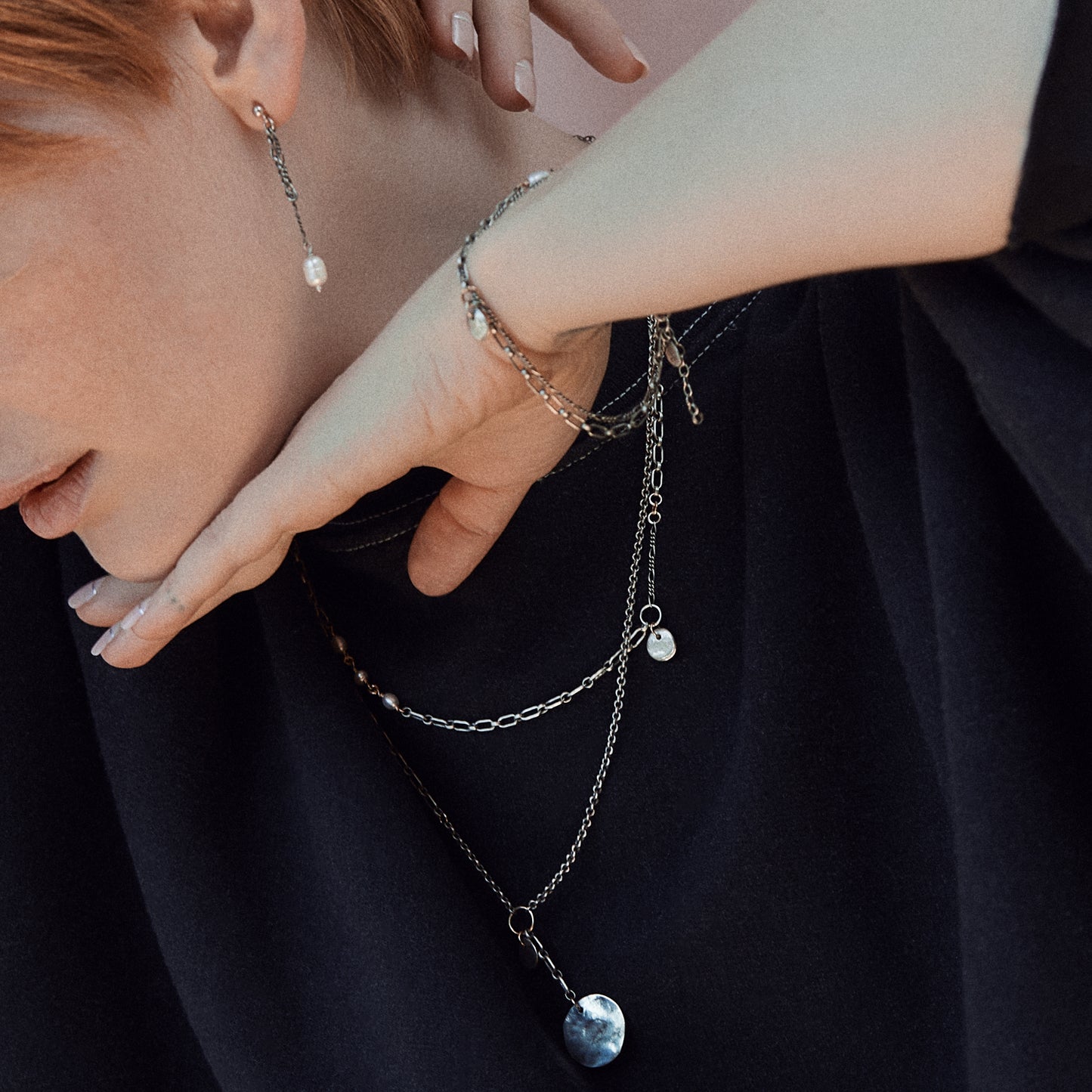 Solid reclaimed sterling silver rock charm with a hand-beaded freshwater pearl on sterling double-chain adjustable 7 -8 inches handmade and finished in our Catskills store-studio shown on model.