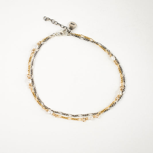 Sterling silver and gold-filled double Figaro chain bracelet 7 inches in diameter with sterling Kria tag hand-beaded with six freshwater pearls and finished in our Catskills store-studio.