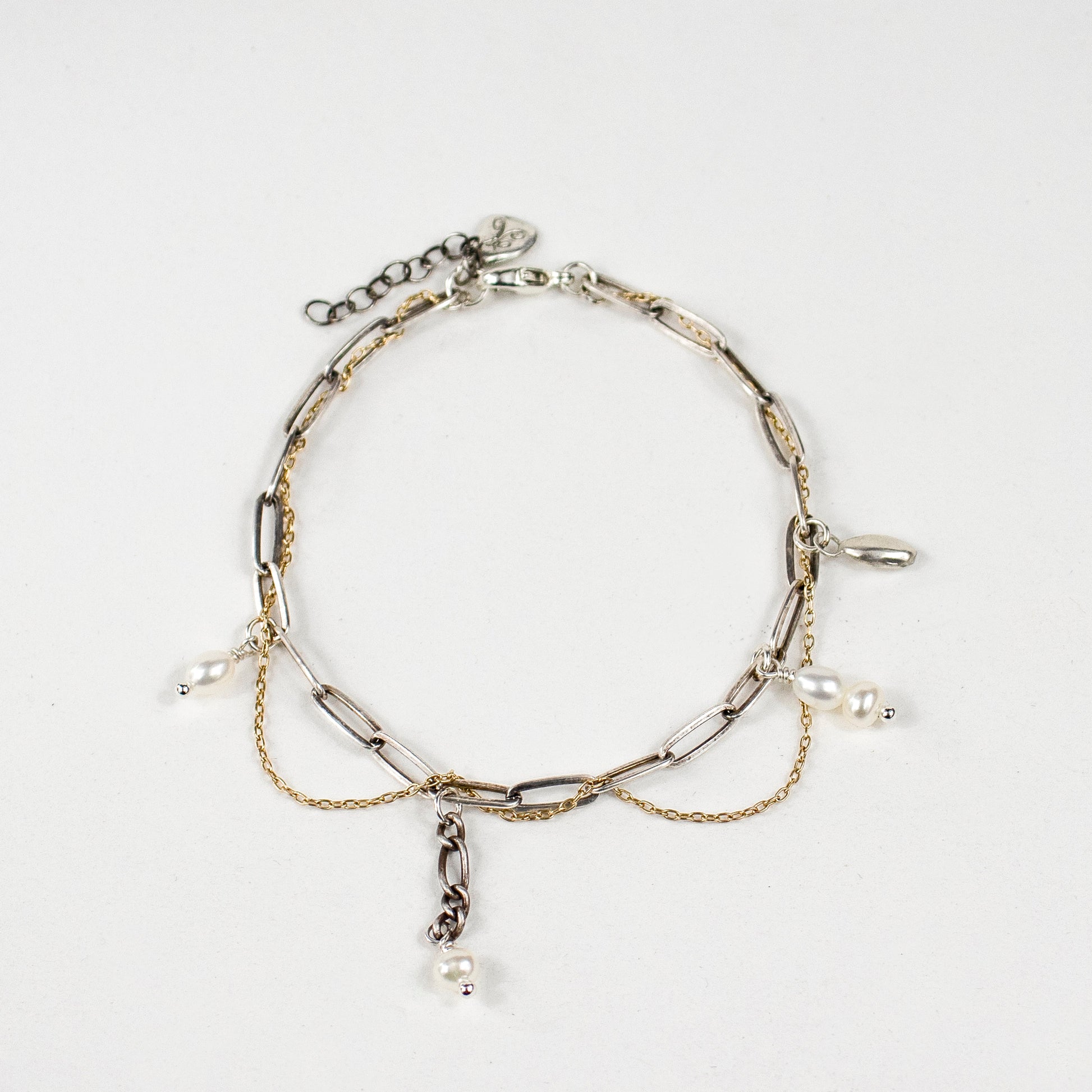 Tangled reclaimed fine gold-filled and sterling silver paperclip chains with hand-beaded and drop-chain pearls, sterling seed charm and signature sterling Kria tag on a 7 inch diameter bracelet handmade and finished in our Catskills store-studio.