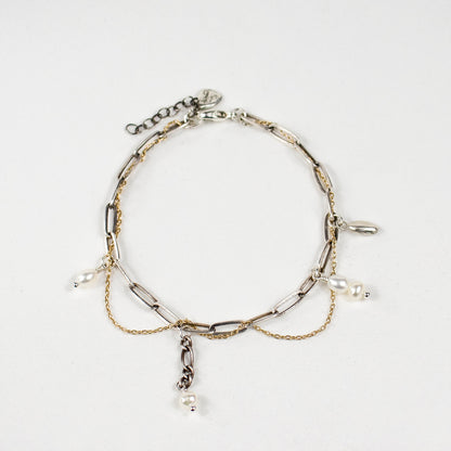 Tangled reclaimed fine gold-filled and sterling silver paperclip chains with hand-beaded and drop-chain pearls, sterling seed charm and signature sterling Kria tag on a 7 inch diameter bracelet handmade and finished in our Catskills store-studio.