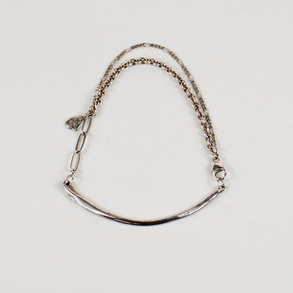 Arc charm measuring 2 inches in length available in reclaimed sterling silver or brass on a gold-filled and sterling mixed-chain bracelet handmade and finished in our Catskills store-studio