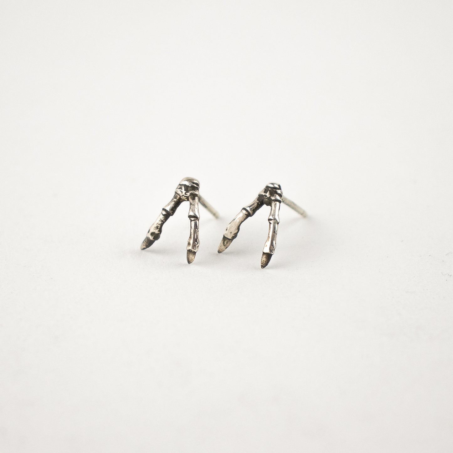 Solid reclaimed sterling silver double-branch stud earrings handmade and finished in our Catskills store-studio.