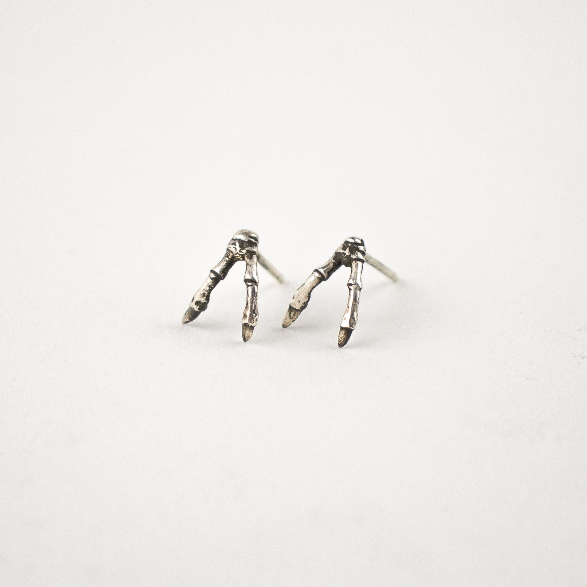 Solid reclaimed sterling silver double-branch stud earrings handmade and finished in our Catskills store-studio.