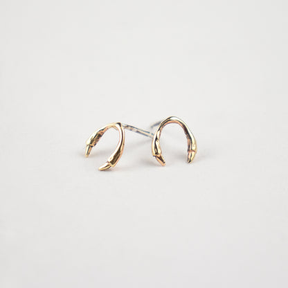 Solid reclaimed 10k gold branch horseshoe stud earrings on sterling silver posts handmade and finished in our Catskills store-studio.