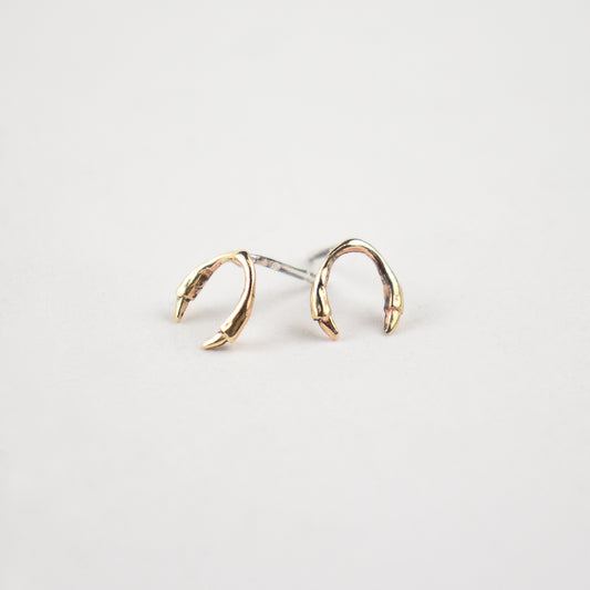 Solid reclaimed 10k gold branch horseshoe stud earrings on sterling silver posts handmade and finished in our Catskills store-studio.