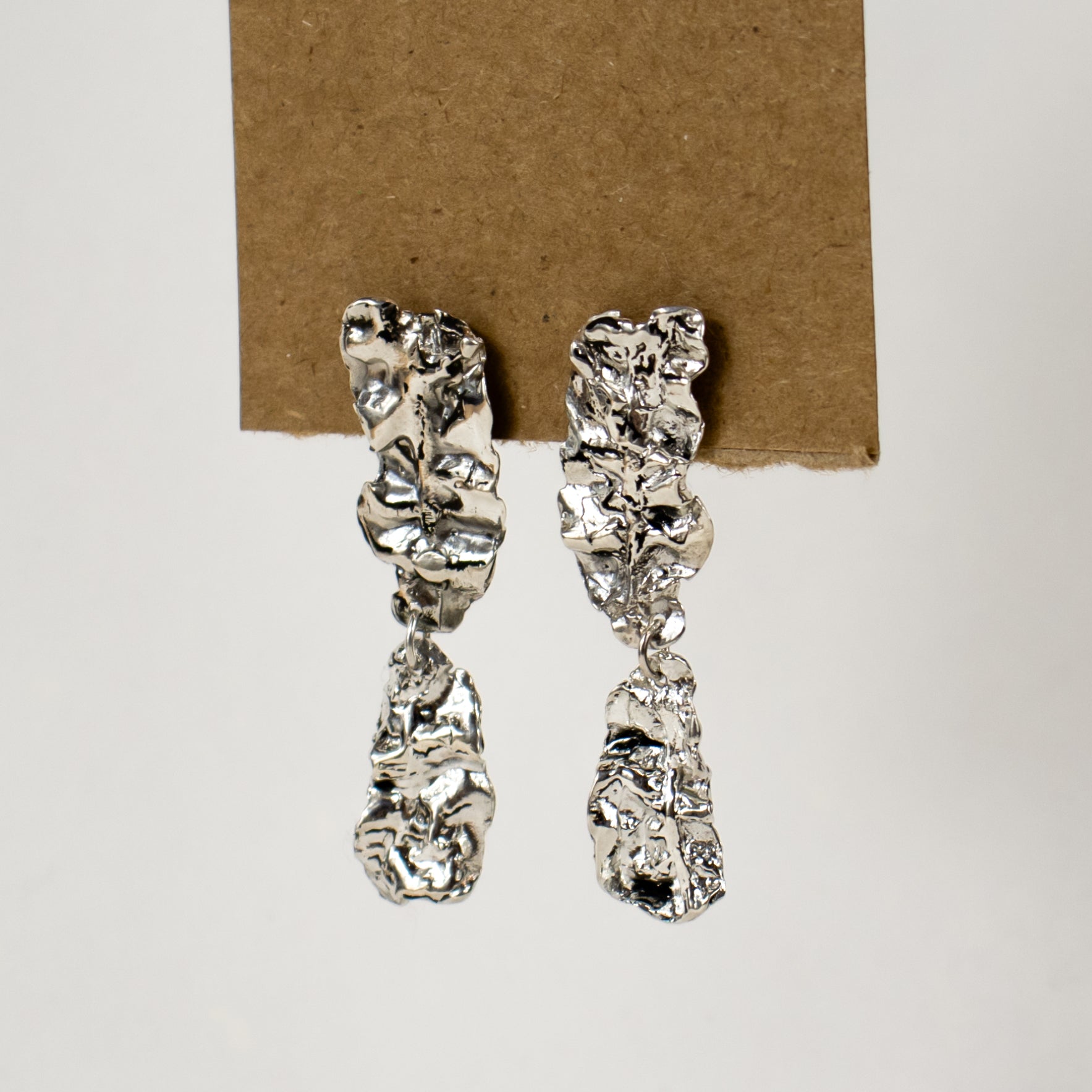 Reclaimed sterling silver double-wave seaweed stud earrings measuring 2 inches in length handmade and finished in our Catskills store-studio.