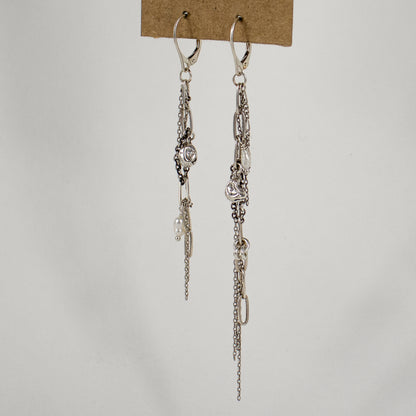Two reclaimed sterling silver seaweed pods, tangled silver mixed-chain tassels, and freshwater pearl earrings.
