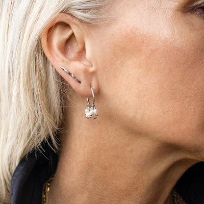 Solid reclaimed sterling silver branch-bud 0.75 inch earrings with sterling stems handmade and finished in our Catskills store-studio shown on model.