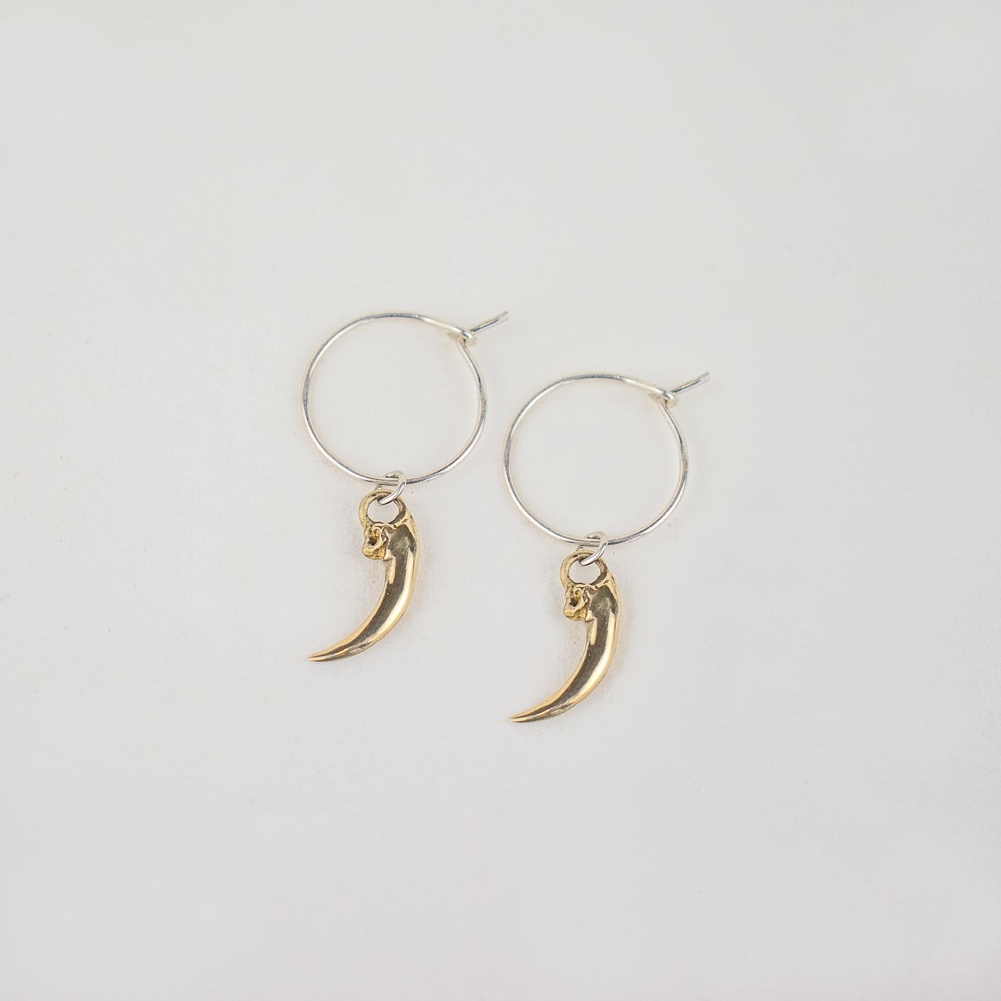 Solid reclaimed sterling silver or brass Icelandic 0.75 inch owl claws on handmade sterling hoops finished in our Catskills store-studio.