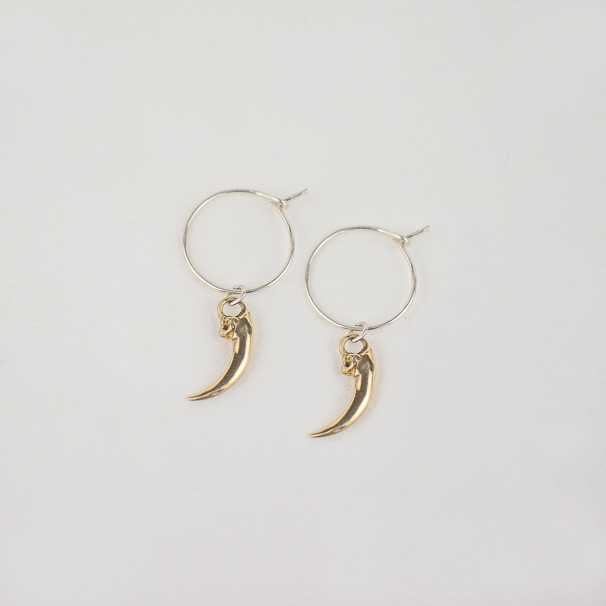 Solid reclaimed sterling silver or brass Icelandic 0.75 inch owl claws on handmade sterling hoops finished in our Catskills store-studio.