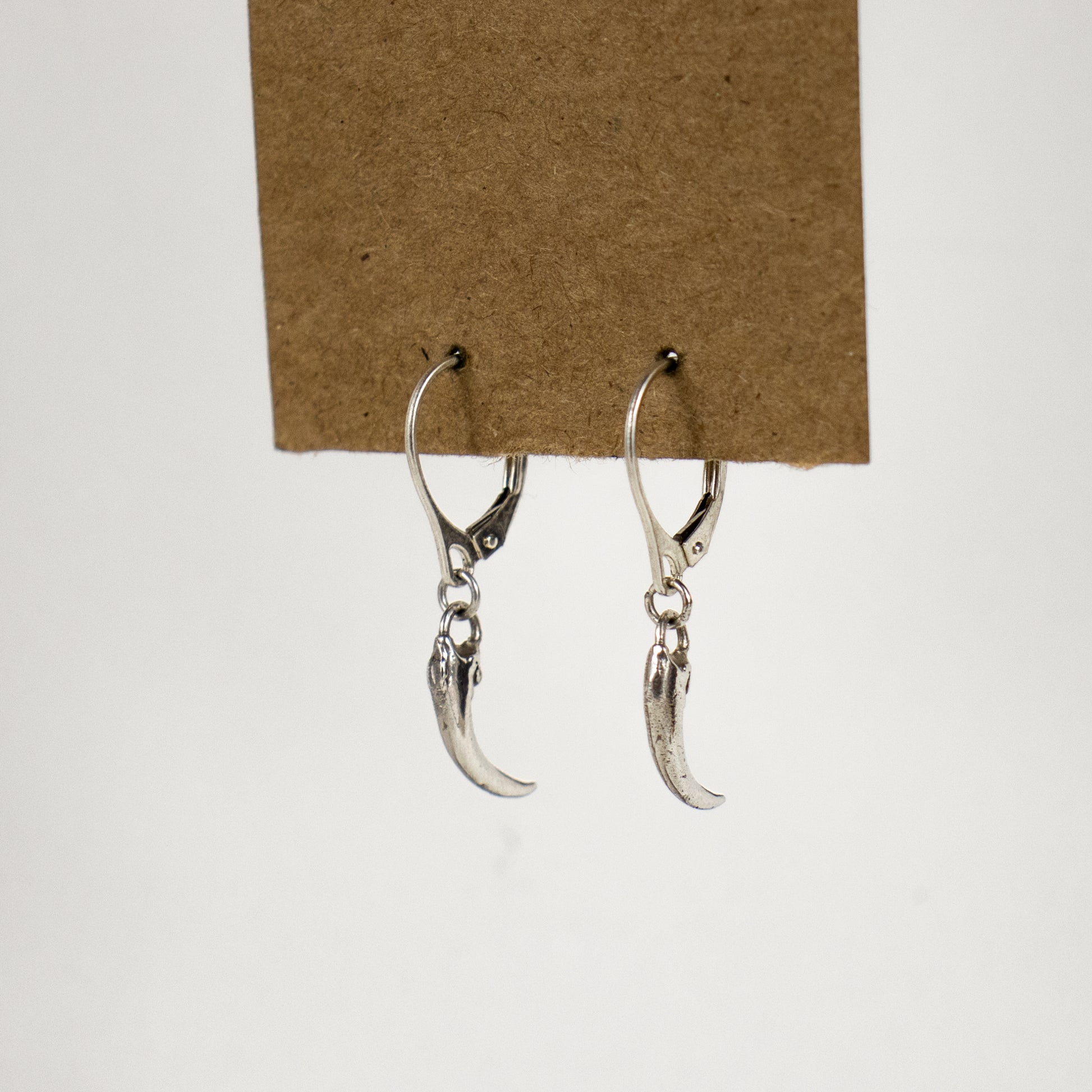 Solid reclaimed sterling silver or brass Icelandic 0.75 inch owl claws on sterling hoops finished in our Catskills store-studio and available as singles to mix-and-match.
