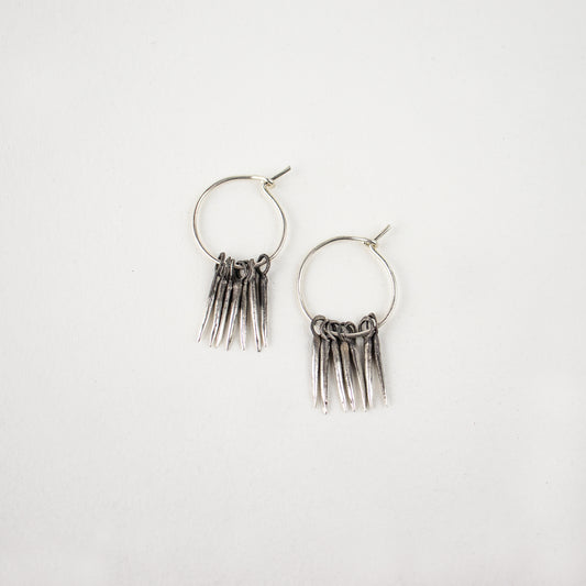 Seven solid reclaimed sterling silver partially oxidized 0.5 inch snake-spikes on handmade sterling hoops handmade and finished in our Catskills store-studio and available as singles to mix-and-match.